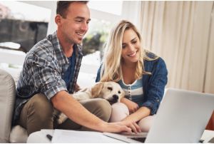 Couple researching savings products on computer